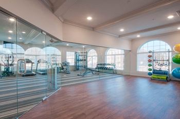 Fitness Center With Modern Equipment at Village Center Apartments At Wormans Mill*, Frederick, MD